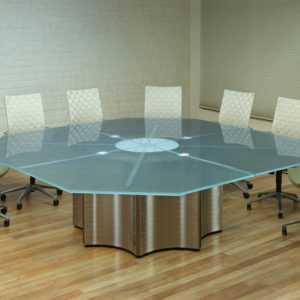 An Octagon shape Conference Table from our Crescent line with a Glass top and Stainless Steel base.
