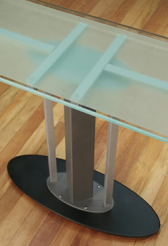 glass console with steel legs