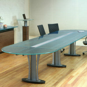 Tangent Racetrack shape custom conference table by Stoneline Designs. Glass tabletop on steel base.