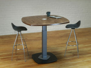 Standing Meeting tables and bar height tables with metal bases and wiring grommets.